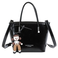 Chic black patent leather bucket bag with metallic logo and cute cartoon charm - Black With Pendant