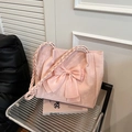 Pale pink tote bag featuring a large satin bow and woven rope handles for a sweet style - Pink