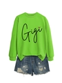 Détail du sweatshirt vert fluo avec imprimé Gigi et motif de cœur léopard - Vert Fluorescent (Motif Noir)