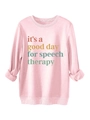 Close-up of ribbed cuffs and colorful speech therapy print on pink fleece sweatshirt - Pink