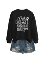 Flat lay of black sweatshirt with white lettering and distressed denim shorts - Black (White Font)