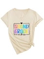 Detail of cream V-neck T-shirt featuring Second Grade vibes print and side-tie knot hem - S / Sand (Black Print)