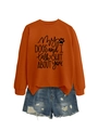 Close-up of My Dogs and I Talk Shit About You print on orange crewneck sweatshirt - Burnt Orange Sweatshirt (Black Font)