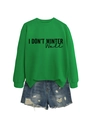 Detail of lime green sweatshirt with 'I DON'T WINTER WELL' print and ripped denim shorts - S / Tops / Grass Green (Black Text)