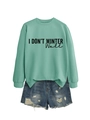 Detail of mint green sweatshirt featuring I Don't Winter Well text and ribbed cuffs - S / Tops / Light Green
