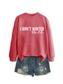 Detail of red sweatshirt with 'I DON'T WINTER WELL' print and distressed denim shorts - S / Tops / Red