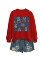 Detail of red crewneck sweatshirt with Proud Supporter of Snow Days print and denim shorts - S / Red