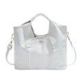 White faux leather bucket bag with large lace bow and gold-tone hardware for women - White