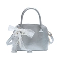 Silver shell-shaped leather handbag with lace bow and pearl pendant on white background - With Pendant / Silver