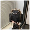 Detail of vintage black bag with butterfly embroidery and golden metal hardware - Black