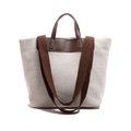 Large cream canvas tote bag with brown leather handles and woven shoulder strap on white base - Brown