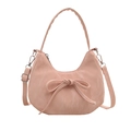 Pink crescent moon underarm bag with decorative bow and textured faux leather finish - Pink
