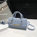Light blue denim texture handbag with gold metal bar and adjustable shoulder strap - Blue