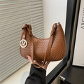 Chic brown woven shoulder bag for women with a gold M pendant and sleek leather strap - Brown