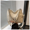 Detail of creamy white shoulder bag with silver butterfly buckle and metal chain strap - White