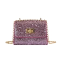 Pink sequin crossbody bag with gold chain strap and turn-lock closure in variant detail - Pink