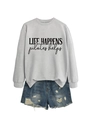 Detail of grey crewneck sweatshirt with Life Happens print and distressed denim shorts - Grey (Black Print)