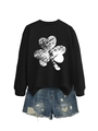 Close-up of black crewneck sweatshirt with clover print and distressed denim shorts - S / Black (White Shamrock Print)