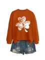 Detail of orange crewneck clover sweatshirt with distressed white print and denim shorts - S / Burnt Orange (White Shamrock Print)