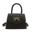 Bolso negro elegante con hebilla de lazo dorado y correa para la moda de primavera 2025 - Negro
