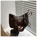 Dark brown woven leather underarm bag with silver butterfly and pleated handle - Coffee