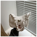 White woven leather underarm bag with butterfly metal buckle and pleated strap detail - White
