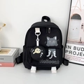 Black cartoon canvas backpack with cat print and round fish charm accessory - Black
