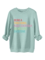 Detail of mint green sweatshirt featuring humorous printed slogan and soft fabric texture - S / Light Green