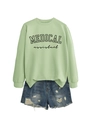 Flat lay of light green Medical Assistant sweatshirt paired with distressed denim shorts - Olive Green Sweatshirt (Black Font)
