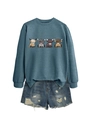 Detail of blue crewneck sweatshirt with four cartoon highland cows and frayed denim shorts - S / Blue