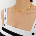 Elegant 18K gold plated twisted flat snake chain necklace worn by a fashion model - 40+5cm
