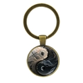 Vintage bronze Yin Yang keychain featuring a glass dome with mystical moon and star nebula - Black and White Cloud and Moon Style (Copper JY008561-9)
