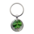 Silver four-leaf clover keychain with a green luck grass pendant on a stone background - Dewdrop Clover Rock Background Style (Silver 10)