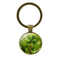Vintage bronze four-leaf clover keychain with a crystal glass dome showing green leaves - Dewdrop Clover Macro Style (Bronze 12)