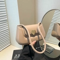Minimalist beige crossbody bag featuring a distinctive gold heart-shaped metal lock - Khaki
