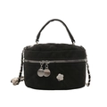 Chic black quilted barrel bag with silver camellia charm and metal chain strap - Black