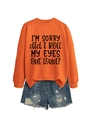 Flat lay of an orange crewneck sweatshirt with black humorous slogan and denim shorts - Orange (Black Font)