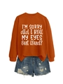 Flat lay of an orange sweatshirt with funny slogan and distressed blue denim shorts - Burnt Orange (White Font)