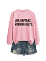 Flat lay of pink sweatshirt with Life Happens Running Helps text and denim shorts - Pink (Black Font)
