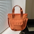 Grand sac fourre-tout orange en nylon avec bandoulière réglable et poche avant pratique - Orange