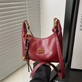 Vintage burgundy crescent shoulder bag with gold hardware and a tassel charm - Red with Pendant