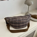 Retro plaid crossbody saddle bag with adjustable brown strap on a white table - Brown