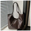Close-up of dark brown woven tote bag featuring a decorative long ribbon bow knot - Coffee