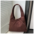 Detail of dark brown suede hobo tote bag featuring a decorative bow tie and soft texture - Dark Brown