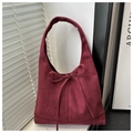 Close-up of wine red faux suede tote bag featuring a decorative bow and soft velvet texture - Burgundy