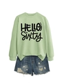 Flat lay of casual light green crewneck sweatshirt with Hello Sixty print and ripped denim shorts - Olive Green Sweatshirt (Black Font)