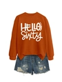 Close-up of Hello Sixty printed orange sweatshirt with distressed denim shorts - Burnt Orange (White Font)