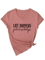 Detail of pink V-neck Pilates T-shirt with 'life happens' print and knotted hem - Rose Gold (Black Print)