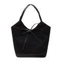 Minimalist black canvas tote bag with faux leather bow accent and trim in a sleek design - Black
