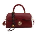 Minimalist deep red square handbag with golden twist lock and woven bell pendant charm - Red with Pendant